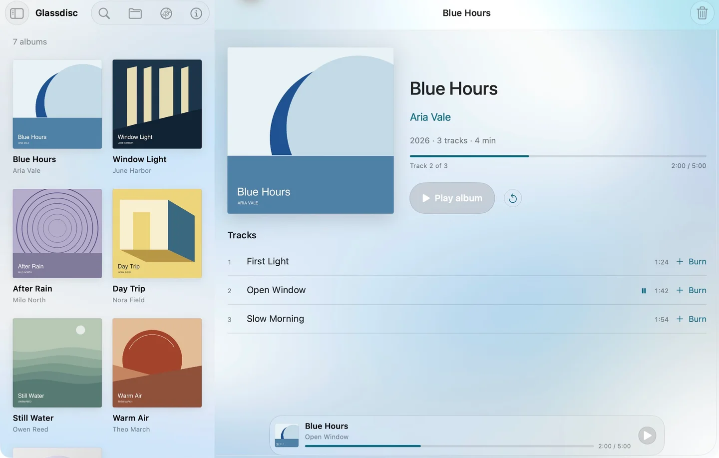 Glassdisc on Mac, with an album library beside the selected album’s track list and playback controls.